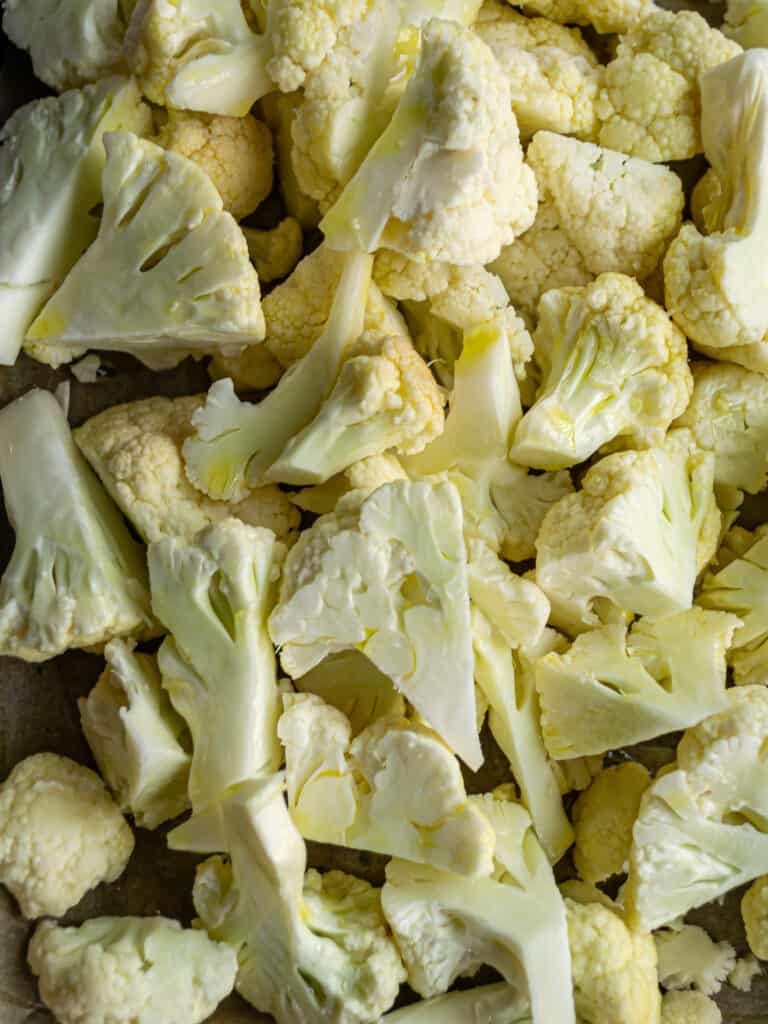 raw cauliflower on a baking tray