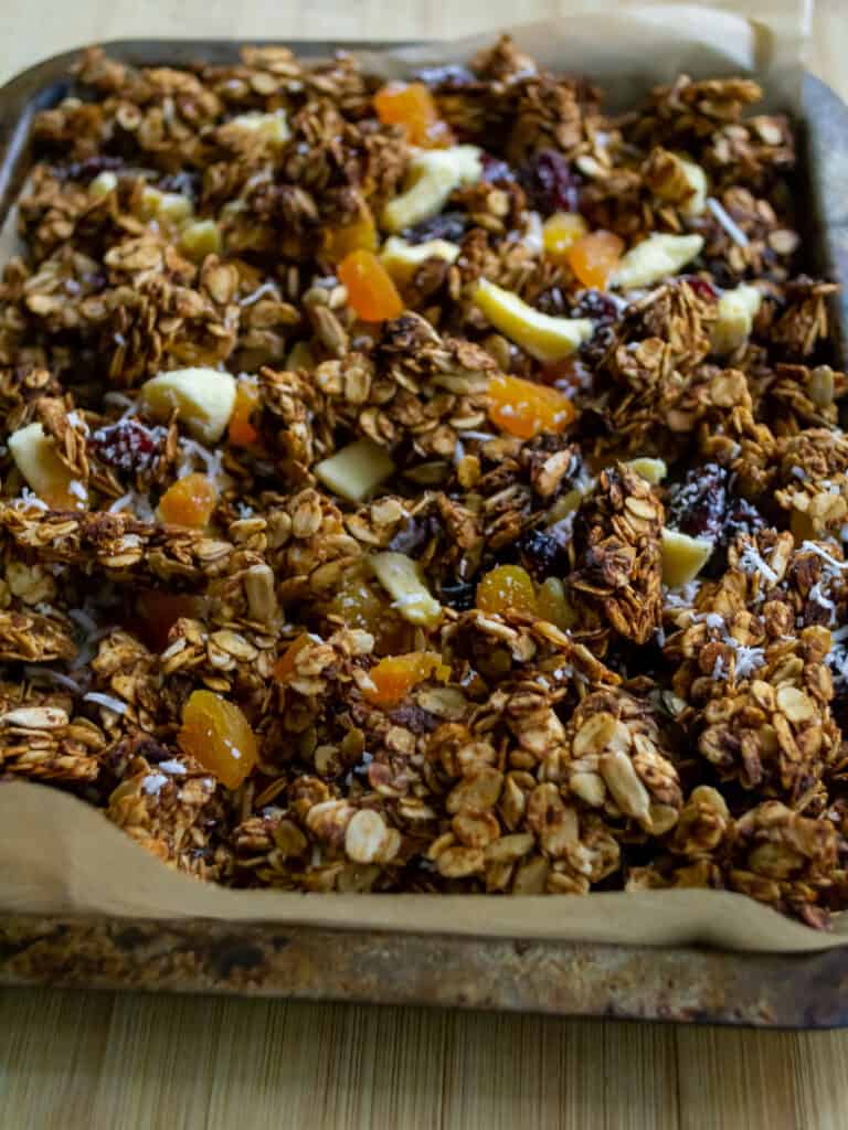 healthy granola with dried fruit on a baking tray