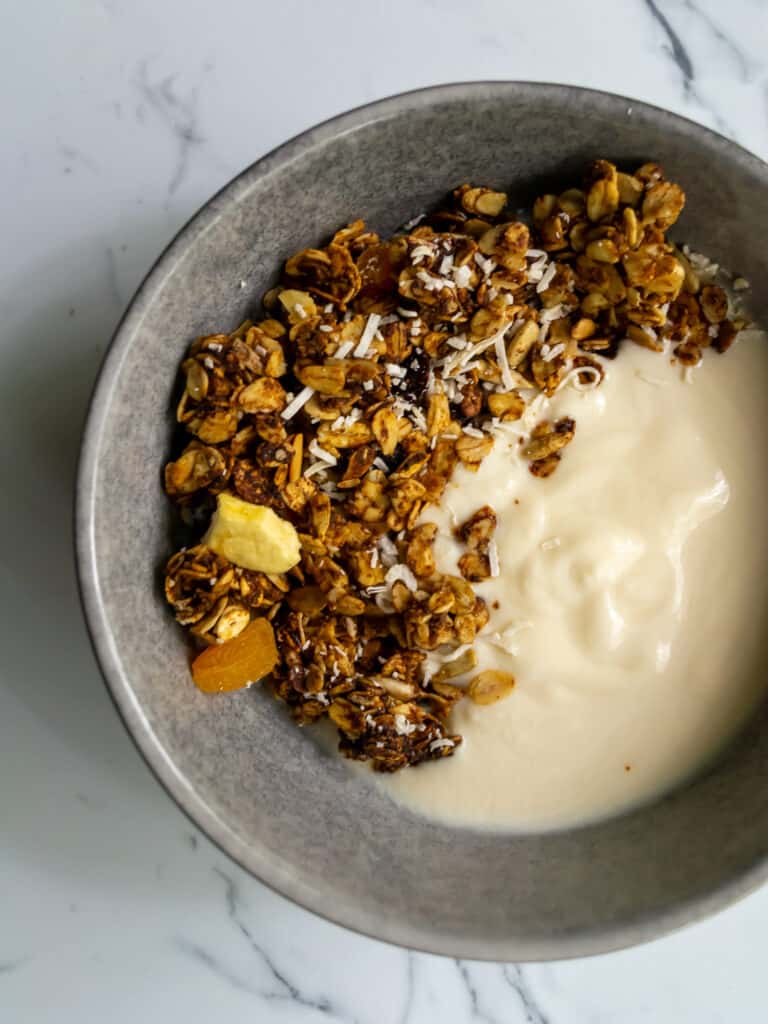 granola in a bowl of yogurt