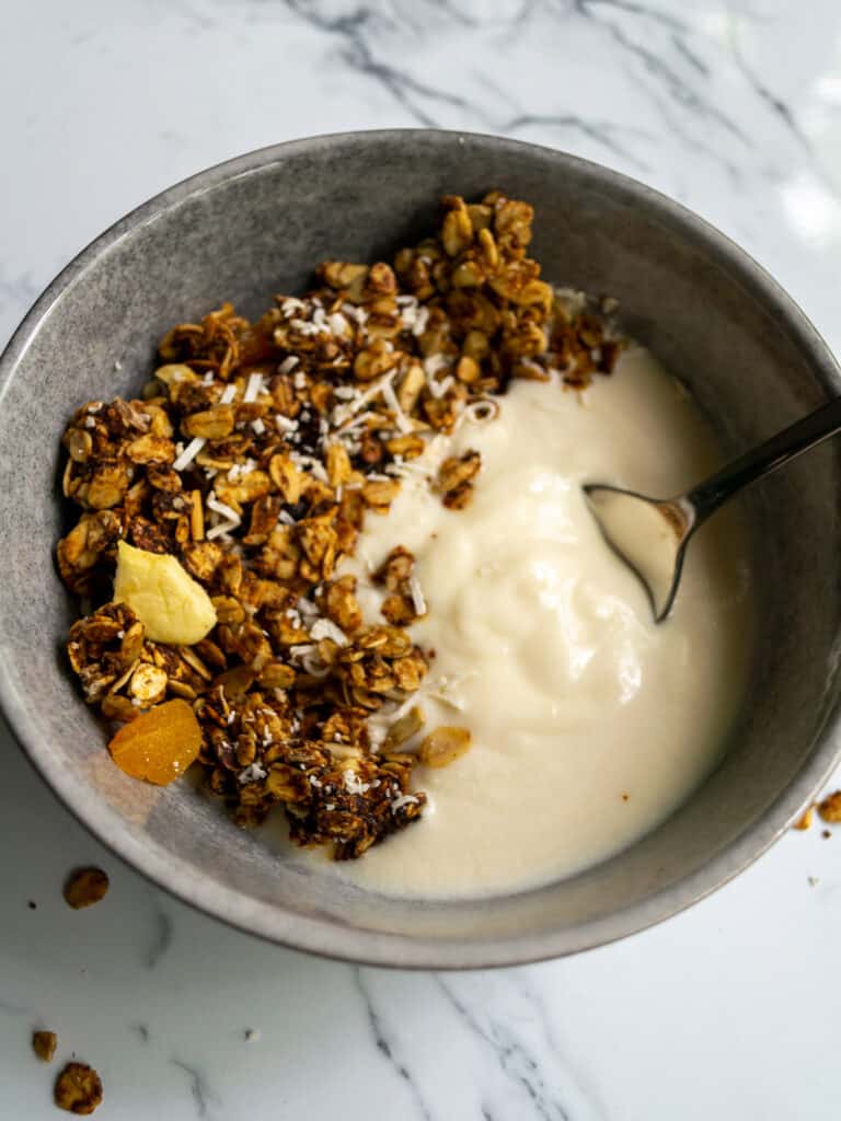 healthy granola with dried fruit and coconut in a bowl