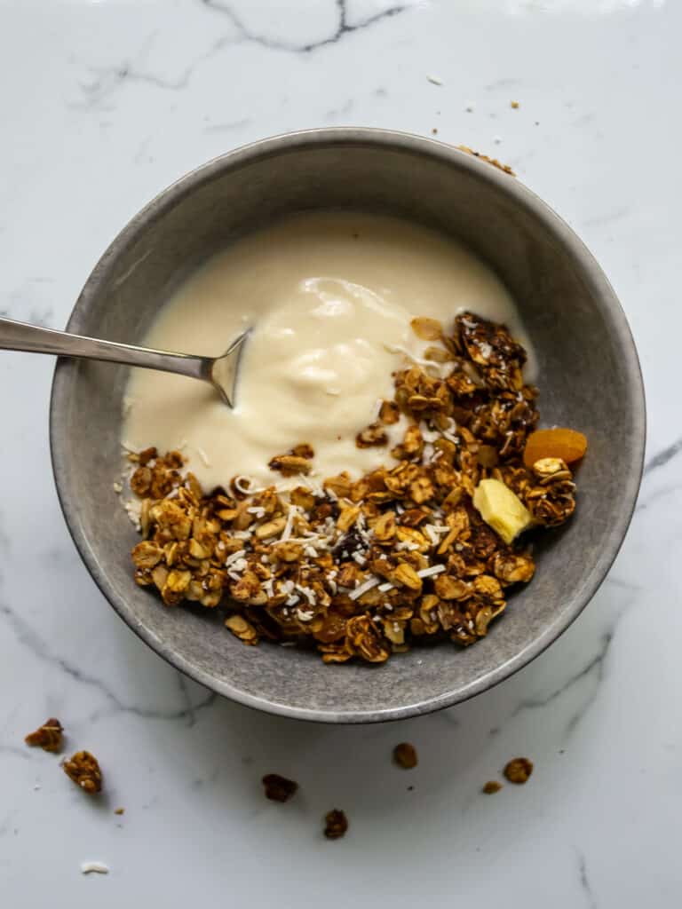 granola in a bowl with a spoon