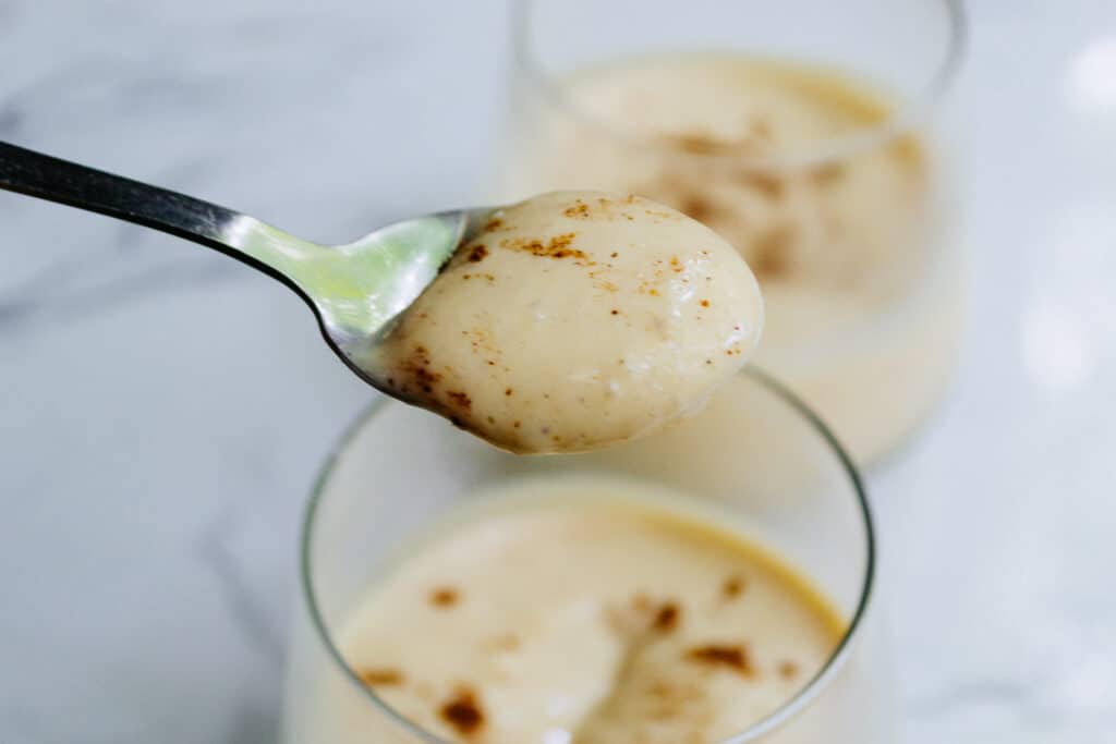 spoon with vegan eggnog pudding