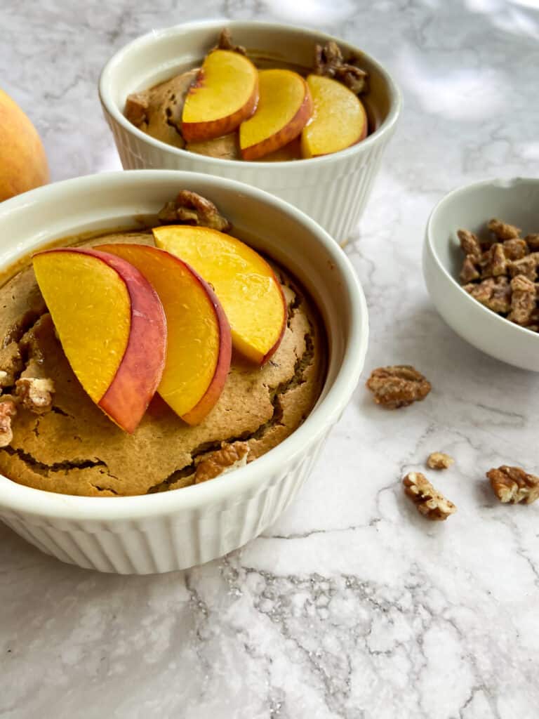 close up view of peach baked oatmeal and nuts