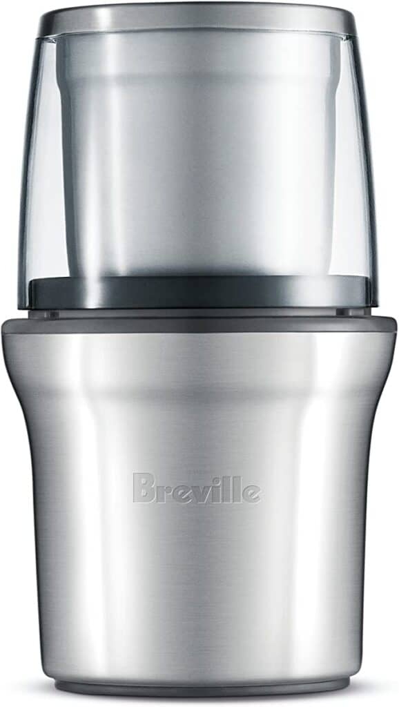 Product shot of a stainless steel Breville coffee and spice grinder on a white background. 
