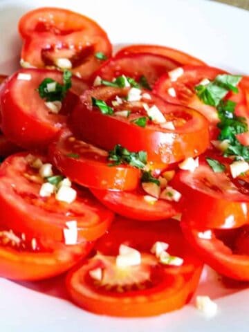 Image thumbnail showing tomato salad on a plate.