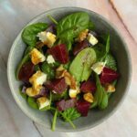 Beetroot goat cheese salad in a bowl.