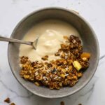 Healthy granola in a bowl of yogurt.