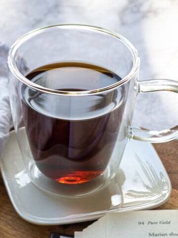 A thumbnail photo showing an image of a glass mug of dandelion tea.