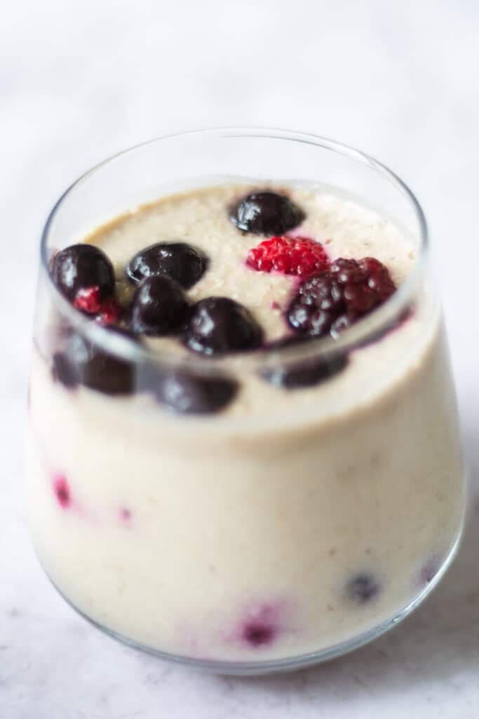 Close up of blended overnight oats with berries.
