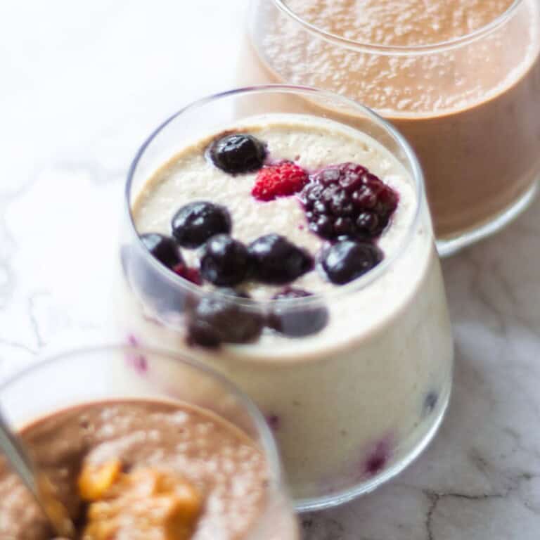 Fresh berry smoothie with mixed berries in a clear glass, showcasing vibrant colors and creamy texture. Perfect for a healthy breakfast or snack, rich in antioxidants and vitamins.