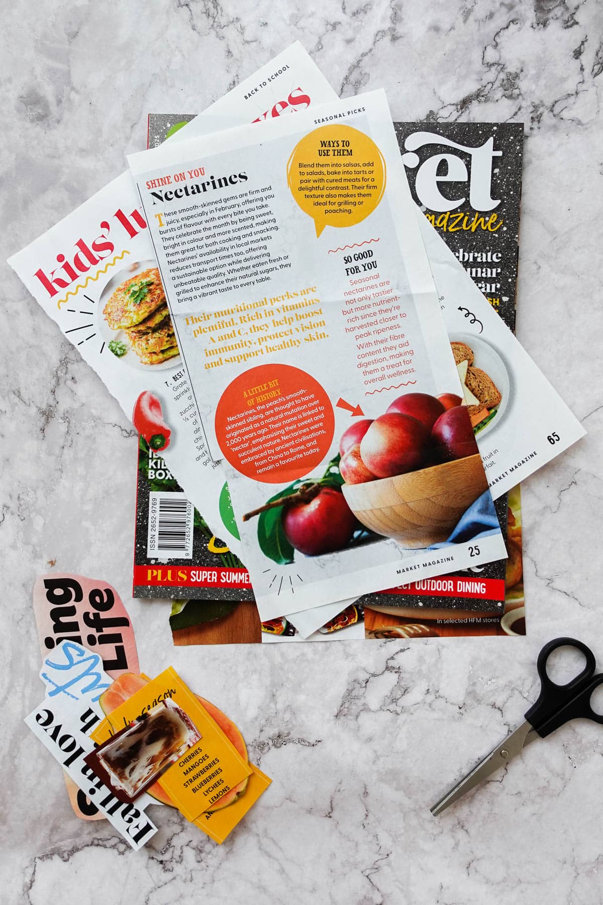 Overhead view showing magazine cutouts and scissors.
