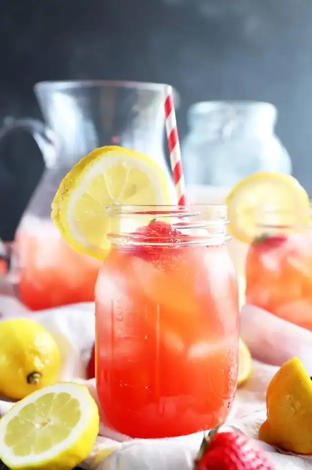 Vodka strawberry lemonade served in a jar with ice.